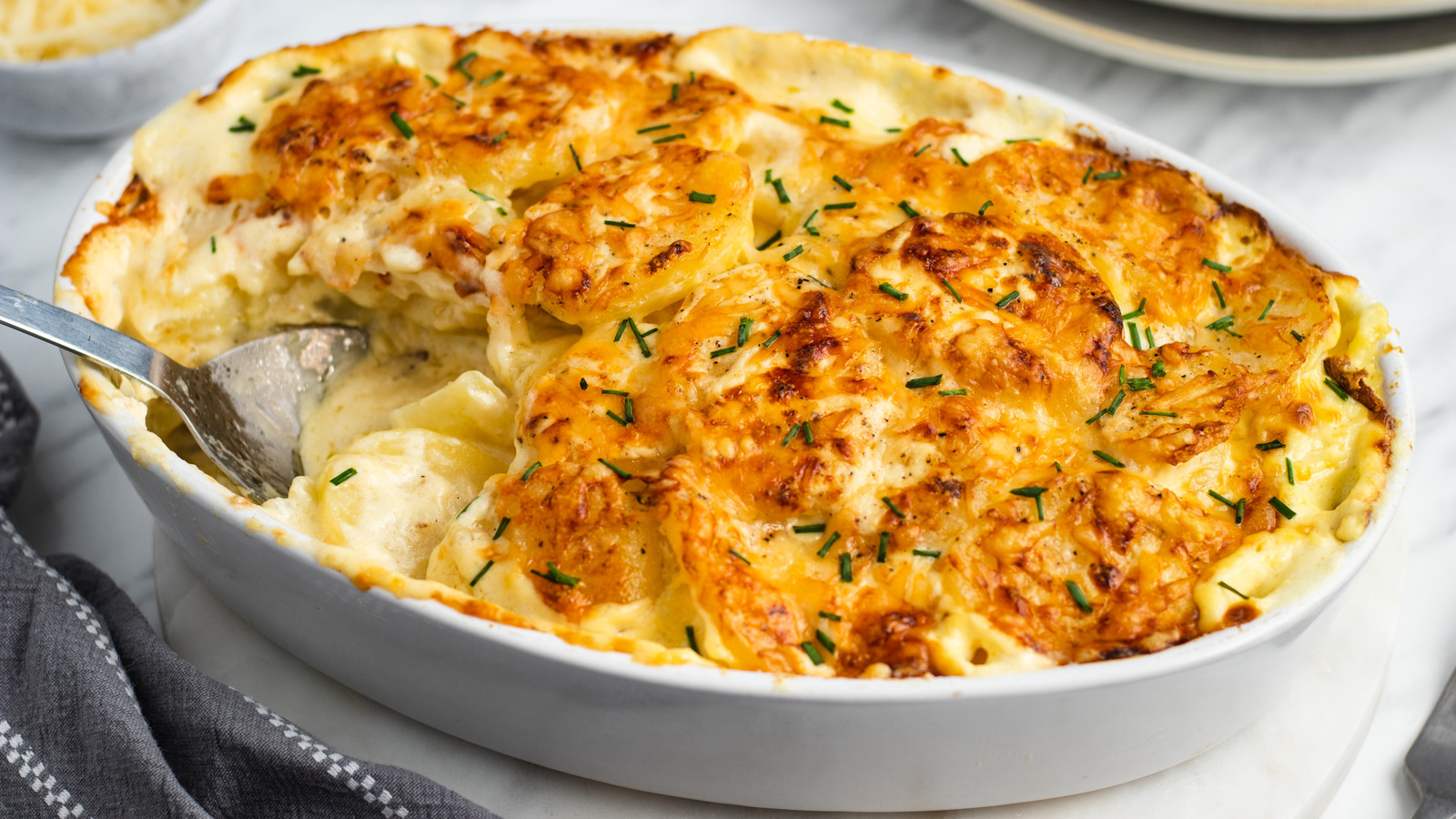 Potatoes au Gratin served with Chives and Gruyere