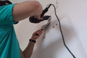 how to remove double sided tape from wall